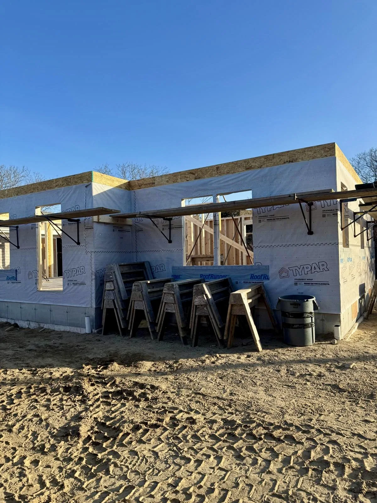Close-up of the residential construction framing with materials ready for the next stage of the build.